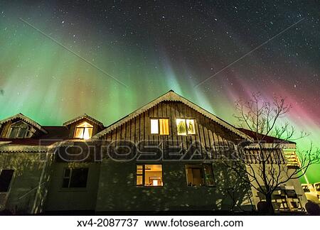 Northern lights above small village of Bleidabollstadur, Vatnajokull National Park, Iceland. View Large Photo Image Stock Photo - Northern lights above small village of Bleidabollstadur, Vatnajokull National Park, Iceland.. Fotosearch