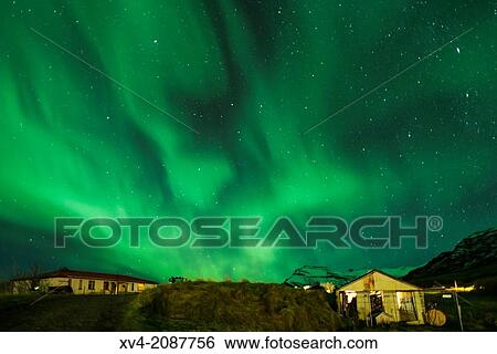 Northern lights above small village of Bleidabollstadur, Vatnajokull National Park, Iceland. View Large Photo Image Stock Photograph - Northern lights above small village of Bleidabollstadur, Vatnajokull National Park, Iceland.. Fotosearch