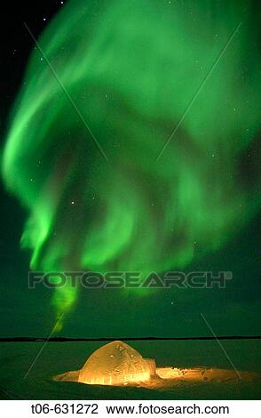 Stock Image - Northern lights (Aurora borealis) in winter, Nord West territories, Canada. Fotosearch