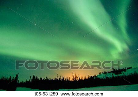 Stock Photo - Northern lights (Aurora borealis) in winter, Nord West territories, Canada. Fotosearch