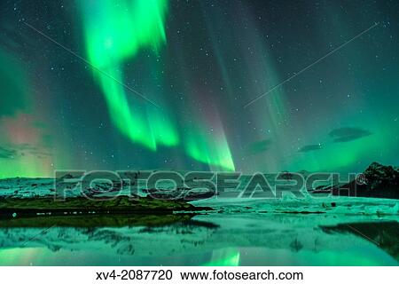 Stock Image - Northern lights in Fjallsarlon, Vatnajokull National Park, Iceland.. Fotosearch