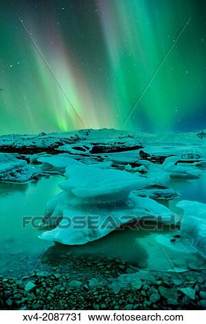 Northern lights in Fjallsarlon, Vatnajokull National Park, Iceland. View Large Photo Image Stock Image - Northern lights in Fjallsarlon, Vatnajokull National Park, Iceland.. Fotosearch