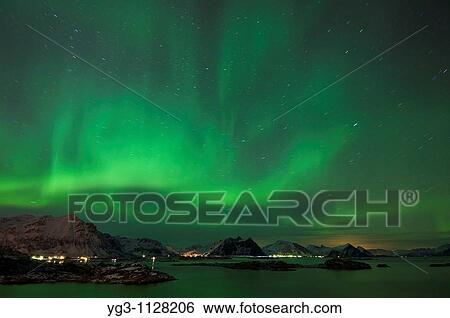 Northern lights shine above mountain peaks of Lofoten Islands, Looking north from Stamsund, Vestv? goy, Norway View Large Photo Image Stock Photograph - Northern lights shine above mountain peaks of Lofoten Islands, Looking north from Stamsund, Vestv? goy, Norway. Fotosearch