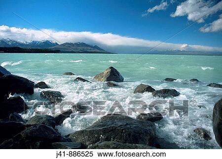 Stock Photography - Northwest wind blows waves on Lake Pukaki New Zealand. Fotosearch