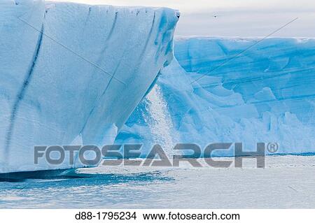 Norway, Svalbard, Spitsbergen, Nordaustlandet, Brasvell's glacier, the ice melt, rivers and fountains flowing water View Large Photo Image Picture - Norway, Svalbard, Spitsbergen, Nordaustlandet, Brasvell's glacier, the ice melt, rivers and fountains flowing water. Fotosearch