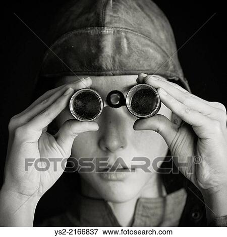 Nostalgic retro styled portrait of serious woman with old fashioned binoculars. View Large Photo Image Stock Photo - Nostalgic retro styled portrait of serious woman with old fashioned binoculars.. Fotosearch