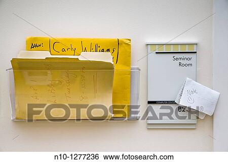 Note and folders outside the door of a college professor View Large Photo Image Stock Photograph - Note and folders outside the door of a college professor. Fotosearch