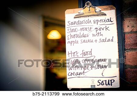 Notice board of a little sandwich shop ofering, Soup, sandwich special, Slow roast pork shoulder with apple sauce and salad, Hot Foods, Chilli con carne with rice and sour cream. Spitalfields Market, London, England, UK, Europe. View Large Photo Image Stock Photo - Notice board of a little sandwich shop ofering, Soup, sandwich special, Slow roast pork shoulder with apple sauce and salad, Hot Foods, Chilli con carne with rice and sour cream. Spitalfields Market, London, England, UK, Europe.. Fotosearch