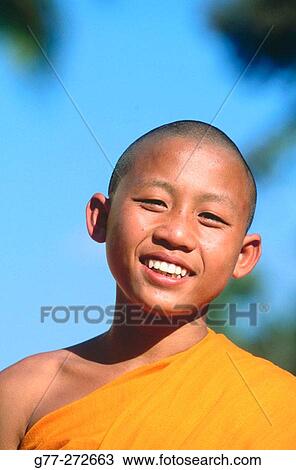 Novice monk at temple. Luang Prabang, Laos View Large Photo Image Stock Image - Novice monk at temple. Luang Prabang, Laos. Fotosearch
