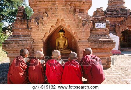 Novice monks praying buddha. Bagan. Myanmar (Burma) View Large Photo Image Stock Image - Novice monks praying buddha. Bagan. Myanmar (Burma). Fotosearch