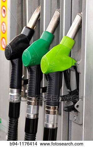 Picture - Nozzles at gas station. Fotosearch