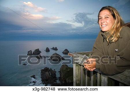 Stock Photo - Nugget Point Lighthouse on the Southern Island, New Zealand. Fotosearch