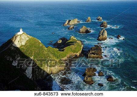 Stock Image - Nugget Point Lighthouse Otago, New Zealand. Fotosearch