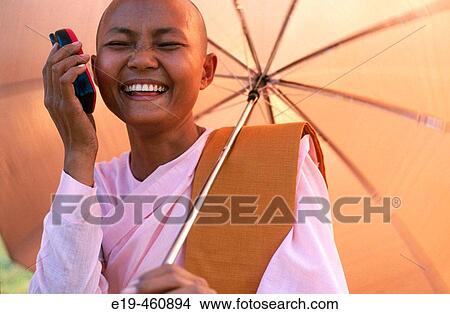 Nun with mobile. Myanmar (Burma) View Large Photo Image Picture - Nun with mobile. Myanmar (Burma). Fotosearch