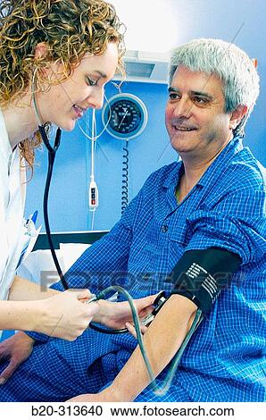 Nurse and patient in hospital room View Large Photo Image Stock Image - Nurse and patient in hospital room. Fotosearch