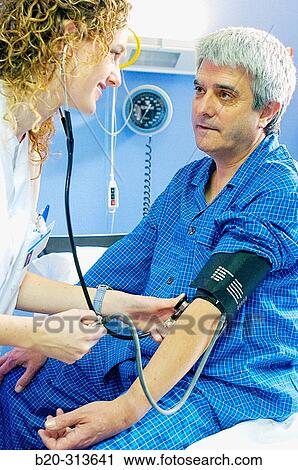 Nurse and patient in hospital room View Large Photo Image Stock Image - Nurse and patient in hospital room. Fotosearch