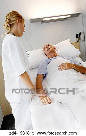 nurse attending to patient in hospital room, Onkologikoa Hospital, Oncology Institute, Case Center for prevention, diagnosis and treatment of cancer, Donostia, San Sebastian, Gipuzkoa, Basque Country, Spain View Large Photo Image Stock Photography - nurse attending to patient in hospital room, Onkologikoa Hospital, Oncology Institute, Case Center for prevention, diagnosis and treatment of cancer, Donostia, San Sebastian, Gipuzkoa, Basque Country, Spain. Fotosearch