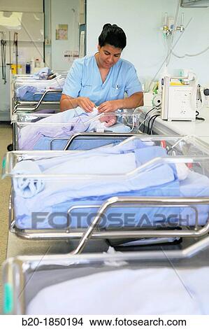 Picture - Nurse care, Neonate Intensive care Unit, Donostia Hospital, San Sebastian, Donostia, Gipuzkoa, Basque Country, Spain. Fotosearch