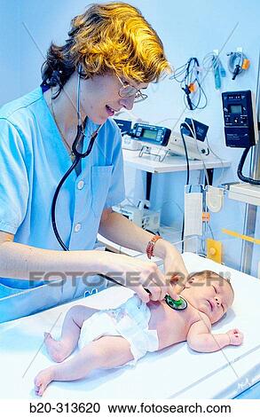 Nurse examinating baby at hospital View Large Photo Image Stock Image - Nurse examinating baby at hospital. Fotosearch