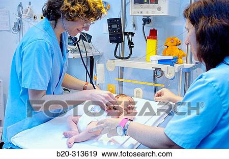 Nurse examinating baby at hospital View Large Photo Image Stock Photo - Nurse examinating baby at hospital. Fotosearch