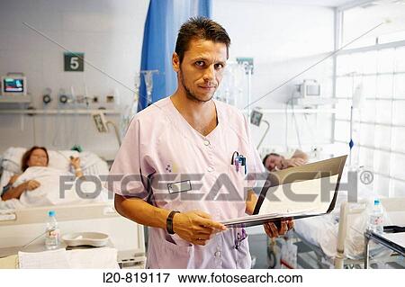 Nurse in emergency area box. Hospital Universitario de Gran Canaria Doctor Negrin, Las Palmas de Gran Canaria. Canary Islands, Spain View Large Photo Image Stock Photo - Nurse in emergency area box. Hospital Universitario de Gran Canaria Doctor Negrin, Las Palmas de Gran Canaria. Canary Islands, Spain. Fotosearch