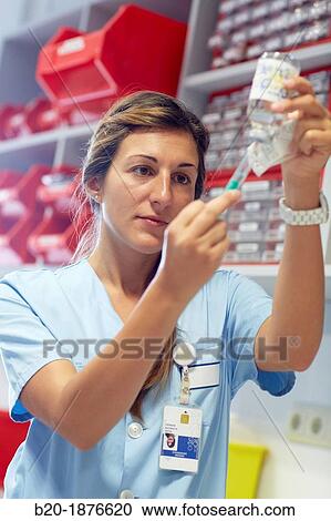 nurse preparing medication, nursing control, plant hospitalization, Hospital Donostia, San Sebastian, Gipuzkoa, Basque Country, Spain View Large Photo Image Stock Image - nurse preparing medication, nursing control, plant hospitalization, Hospital Donostia, San Sebastian, Gipuzkoa, Basque Country, Spain. Fotosearch