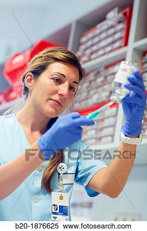 Stock Photography - nurse preparing medication, nursing control, plant hospitalization, Hospital Donostia, San Sebastian, Gipuzkoa, Basque Country, Spain. Fotosearch