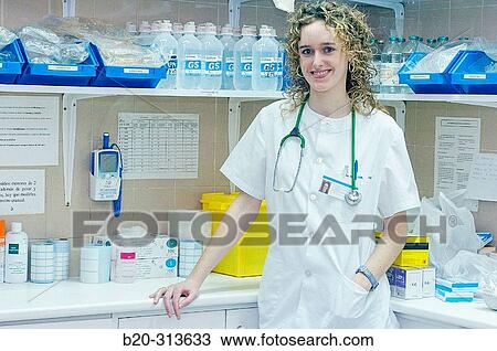 Stock Image - Nurse student at chemist of hospital. Fotosearch