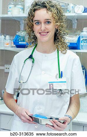 Stock Photography - Nurse student at chemist of hospital. Fotosearch