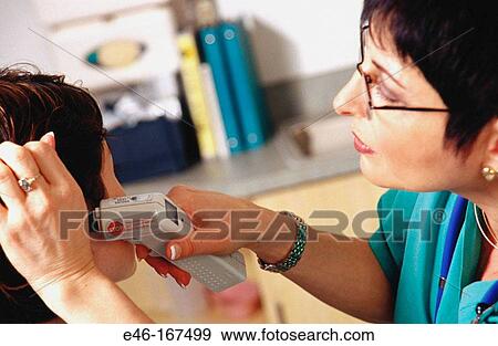 Stock Photo - Nurse taking patient's temperature. Fotosearch