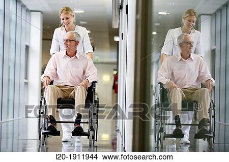 Nurse with patient in wheelchair, Corridor, Onkologikoa Hospital, Oncology Institute, Case Center for prevention, diagnosis and treatment of cancer, Donostia, San Sebastian, Gipuzkoa, Basque Country, Spain View Large Photo Image Picture - Nurse with patient in wheelchair, Corridor, Onkologikoa Hospital, Oncology Institute, Case Center for prevention, diagnosis and treatment of cancer, Donostia, San Sebastian, Gipuzkoa, Basque Country, Spain. Fotosearch