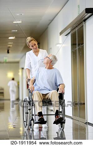 Nurse with patient in wheelchair, Corridor, Onkologikoa Hospital, Oncology Institute, Case Center for prevention, diagnosis and treatment of cancer, Donostia, San Sebastian, Gipuzkoa, Basque Country, Spain View Large Photo Image Picture - Nurse with patient in wheelchair, Corridor, Onkologikoa Hospital, Oncology Institute, Case Center for prevention, diagnosis and treatment of cancer, Donostia, San Sebastian, Gipuzkoa, Basque Country, Spain. Fotosearch