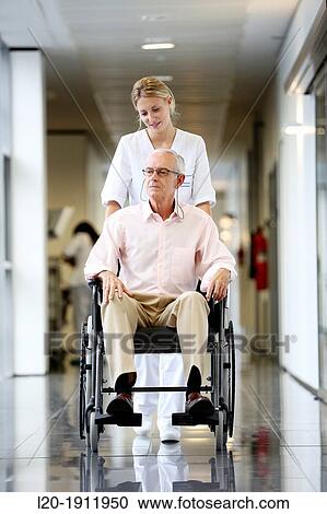 Nurse with patient in wheelchair, Corridor, Onkologikoa Hospital, Oncology Institute, Case Center for prevention, diagnosis and treatment of cancer, Donostia, San Sebastian, Gipuzkoa, Basque Country, Spain View Large Photo Image Stock Image - Nurse with patient in wheelchair, Corridor, Onkologikoa Hospital, Oncology Institute, Case Center for prevention, diagnosis and treatment of cancer, Donostia, San Sebastian, Gipuzkoa, Basque Country, Spain. Fotosearch