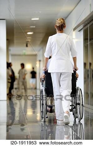 Nurse with patient in wheelchair, Corridor, Onkologikoa Hospital, Oncology Institute, Case Center for prevention, diagnosis and treatment of cancer, Donostia, San Sebastian, Gipuzkoa, Basque Country, Spain View Large Photo Image Stock Image - Nurse with patient in wheelchair, Corridor, Onkologikoa Hospital, Oncology Institute, Case Center for prevention, diagnosis and treatment of cancer, Donostia, San Sebastian, Gipuzkoa, Basque Country, Spain. Fotosearch