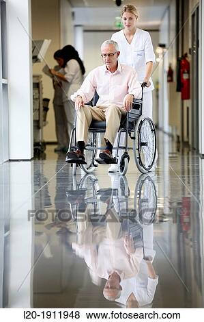 Nurse with patient in wheelchair, Corridor, Onkologikoa Hospital, Oncology Institute, Case Center for prevention, diagnosis and treatment of cancer, Donostia, San Sebastian, Gipuzkoa, Basque Country, Spain View Large Photo Image Stock Photo - Nurse with patient in wheelchair, Corridor, Onkologikoa Hospital, Oncology Institute, Case Center for prevention, diagnosis and treatment of cancer, Donostia, San Sebastian, Gipuzkoa, Basque Country, Spain. Fotosearch