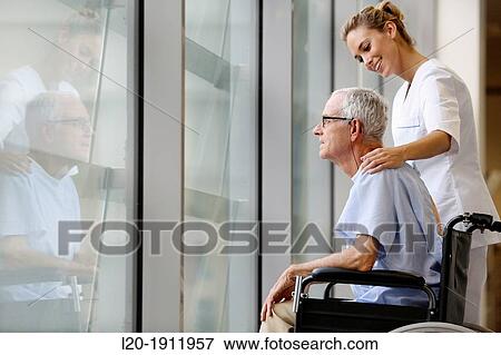 Nurse with patient in wheelchair, Corridor, Onkologikoa Hospital, Oncology Institute, Case Center for prevention, diagnosis and treatment of cancer, Donostia, San Sebastian, Gipuzkoa, Basque Country, Spain View Large Photo Image Stock Photo - Nurse with patient in wheelchair, Corridor, Onkologikoa Hospital, Oncology Institute, Case Center for prevention, diagnosis and treatment of cancer, Donostia, San Sebastian, Gipuzkoa, Basque Country, Spain. Fotosearch