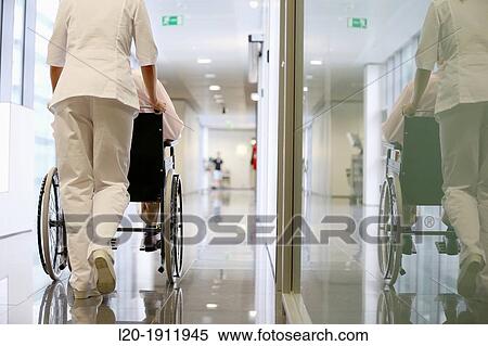 Nurse with patient in wheelchair, Corridor, Onkologikoa Hospital, Oncology Institute, Case Center for prevention, diagnosis and treatment of cancer, Donostia, San Sebastian, Gipuzkoa, Basque Country, Spain View Large Photo Image Stock Photography - Nurse with patient in wheelchair, Corridor, Onkologikoa Hospital, Oncology Institute, Case Center for prevention, diagnosis and treatment of cancer, Donostia, San Sebastian, Gipuzkoa, Basque Country, Spain. Fotosearch