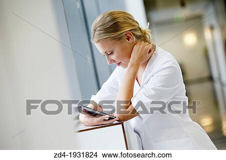 Nurse with tablet in corridor, Onkologikoa Hospital, Oncology Institute, Case Center for prevention, diagnosis and treatment of cancer, Donostia, San Sebastian, Gipuzkoa, Basque Country, Spain View Large Photo Image Picture - Nurse with tablet in corridor, Onkologikoa Hospital, Oncology Institute, Case Center for prevention, diagnosis and treatment of cancer, Donostia, San Sebastian, Gipuzkoa, Basque Country, Spain. Fotosearch