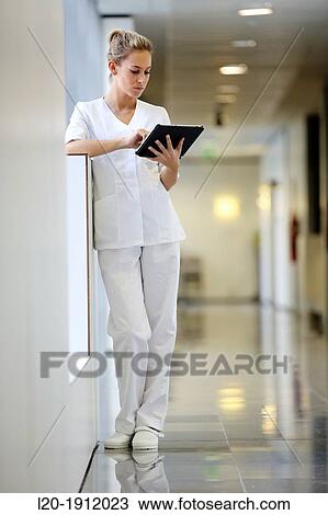 Nurse with tablet in corridor, Onkologikoa Hospital, Oncology Institute, Case Center for prevention, diagnosis and treatment of cancer, Donostia, San Sebastian, Gipuzkoa, Basque Country, Spain View Large Photo Image Stock Image - Nurse with tablet in corridor, Onkologikoa Hospital, Oncology Institute, Case Center for prevention, diagnosis and treatment of cancer, Donostia, San Sebastian, Gipuzkoa, Basque Country, Spain. Fotosearch