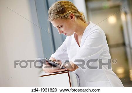 Nurse with tablet in corridor, Onkologikoa Hospital, Oncology Institute, Case Center for prevention, diagnosis and treatment of cancer, Donostia, San Sebastian, Gipuzkoa, Basque Country, Spain View Large Photo Image Stock Image - Nurse with tablet in corridor, Onkologikoa Hospital, Oncology Institute, Case Center for prevention, diagnosis and treatment of cancer, Donostia, San Sebastian, Gipuzkoa, Basque Country, Spain. Fotosearch