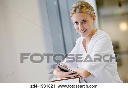 Nurse with tablet in corridor, Onkologikoa Hospital, Oncology Institute, Case Center for prevention, diagnosis and treatment of cancer, Donostia, San Sebastian, Gipuzkoa, Basque Country, Spain View Large Photo Image Stock Image - Nurse with tablet in corridor, Onkologikoa Hospital, Oncology Institute, Case Center for prevention, diagnosis and treatment of cancer, Donostia, San Sebastian, Gipuzkoa, Basque Country, Spain. Fotosearch