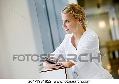 Nurse with tablet in corridor, Onkologikoa Hospital, Oncology Institute, Case Center for prevention, diagnosis and treatment of cancer, Donostia, San Sebastian, Gipuzkoa, Basque Country, Spain View Large Photo Image Stock Image - Nurse with tablet in corridor, Onkologikoa Hospital, Oncology Institute, Case Center for prevention, diagnosis and treatment of cancer, Donostia, San Sebastian, Gipuzkoa, Basque Country, Spain. Fotosearch