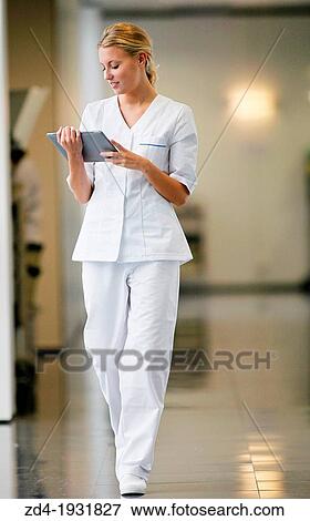 Nurse with tablet in corridor, Onkologikoa Hospital, Oncology Institute, Case Center for prevention, diagnosis and treatment of cancer, Donostia, San Sebastian, Gipuzkoa, Basque Country, Spain View Large Photo Image Stock Photo - Nurse with tablet in corridor, Onkologikoa Hospital, Oncology Institute, Case Center for prevention, diagnosis and treatment of cancer, Donostia, San Sebastian, Gipuzkoa, Basque Country, Spain. Fotosearch