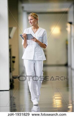 Nurse with tablet in corridor, Onkologikoa Hospital, Oncology Institute, Case Center for prevention, diagnosis and treatment of cancer, Donostia, San Sebastian, Gipuzkoa, Basque Country, Spain View Large Photo Image Stock Photo - Nurse with tablet in corridor, Onkologikoa Hospital, Oncology Institute, Case Center for prevention, diagnosis and treatment of cancer, Donostia, San Sebastian, Gipuzkoa, Basque Country, Spain. Fotosearch