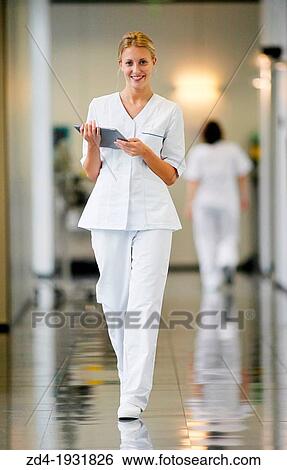 Nurse with tablet in corridor, Onkologikoa Hospital, Oncology Institute, Case Center for prevention, diagnosis and treatment of cancer, Donostia, San Sebastian, Gipuzkoa, Basque Country, Spain View Large Photo Image Stock Photograph - Nurse with tablet in corridor, Onkologikoa Hospital, Oncology Institute, Case Center for prevention, diagnosis and treatment of cancer, Donostia, San Sebastian, Gipuzkoa, Basque Country, Spain. Fotosearch
