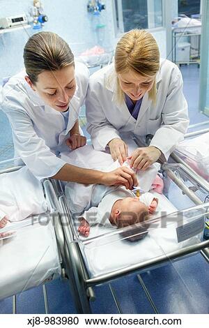 Nurses and newborn babies, child-care unit, pediatrics. Hospital Policlinica Gipuzkoa, San Sebastian, Donostia, Euskadi, Spain View Large Photo Image Stock Image - Nurses and newborn babies, child-care unit, pediatrics. Hospital Policlinica Gipuzkoa, San Sebastian, Donostia, Euskadi, Spain. Fotosearch