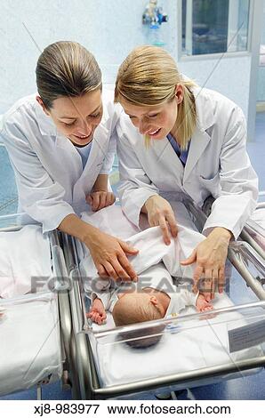Nurses and newborn baby, child-care unit, pediatrics. Hospital Policlinica Gipuzkoa, San Sebastian, Donostia, Euskadi, Spain View Large Photo Image Stock Photo - Nurses and newborn baby, child-care unit, pediatrics. Hospital Policlinica Gipuzkoa, San Sebastian, Donostia, Euskadi, Spain. Fotosearch