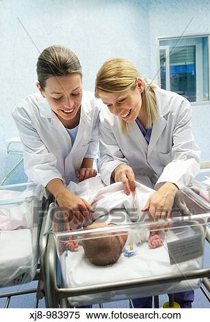 Nurses and newborn baby, child-care unit, pediatrics. Hospital Policlinica Gipuzkoa, San Sebastian, Donostia, Euskadi, Spain View Large Photo Image Stock Photography - Nurses and newborn baby, child-care unit, pediatrics. Hospital Policlinica Gipuzkoa, San Sebastian, Donostia, Euskadi, Spain. Fotosearch