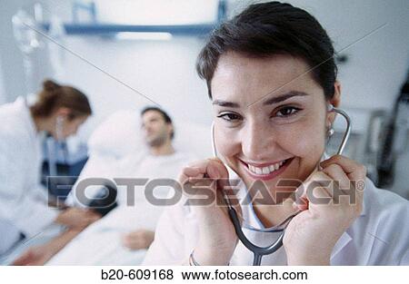 Nurses and patient at hospital View Large Photo Image Stock Photo - Nurses and patient at hospital. Fotosearch