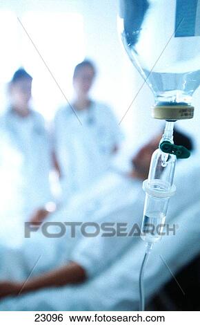 Stock Photograph - Nurses and patient at hospital. Fotosearch